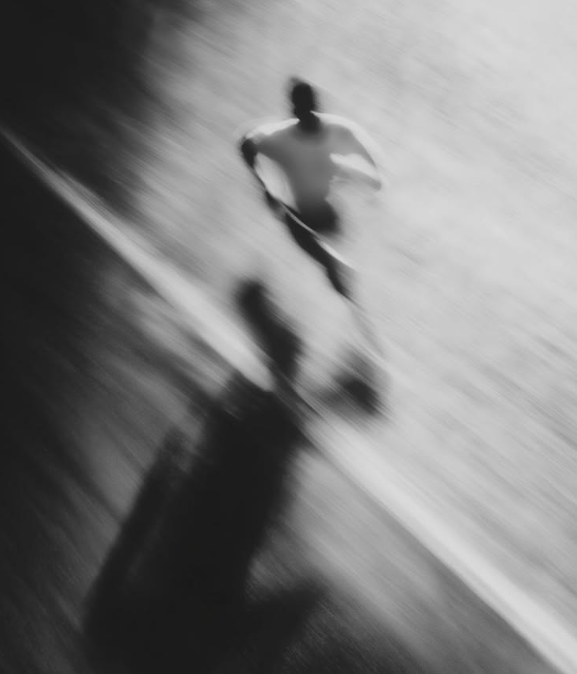Motion-blurred photo of a runner